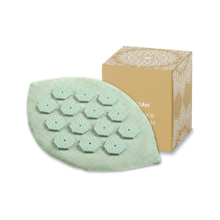 Mintgrüner Akupressur-Handschuh in Blattform mit weißen Massage-Spikes in sechseckiger Anordnung – zur gezielten Druckpunkt-Stimulation.